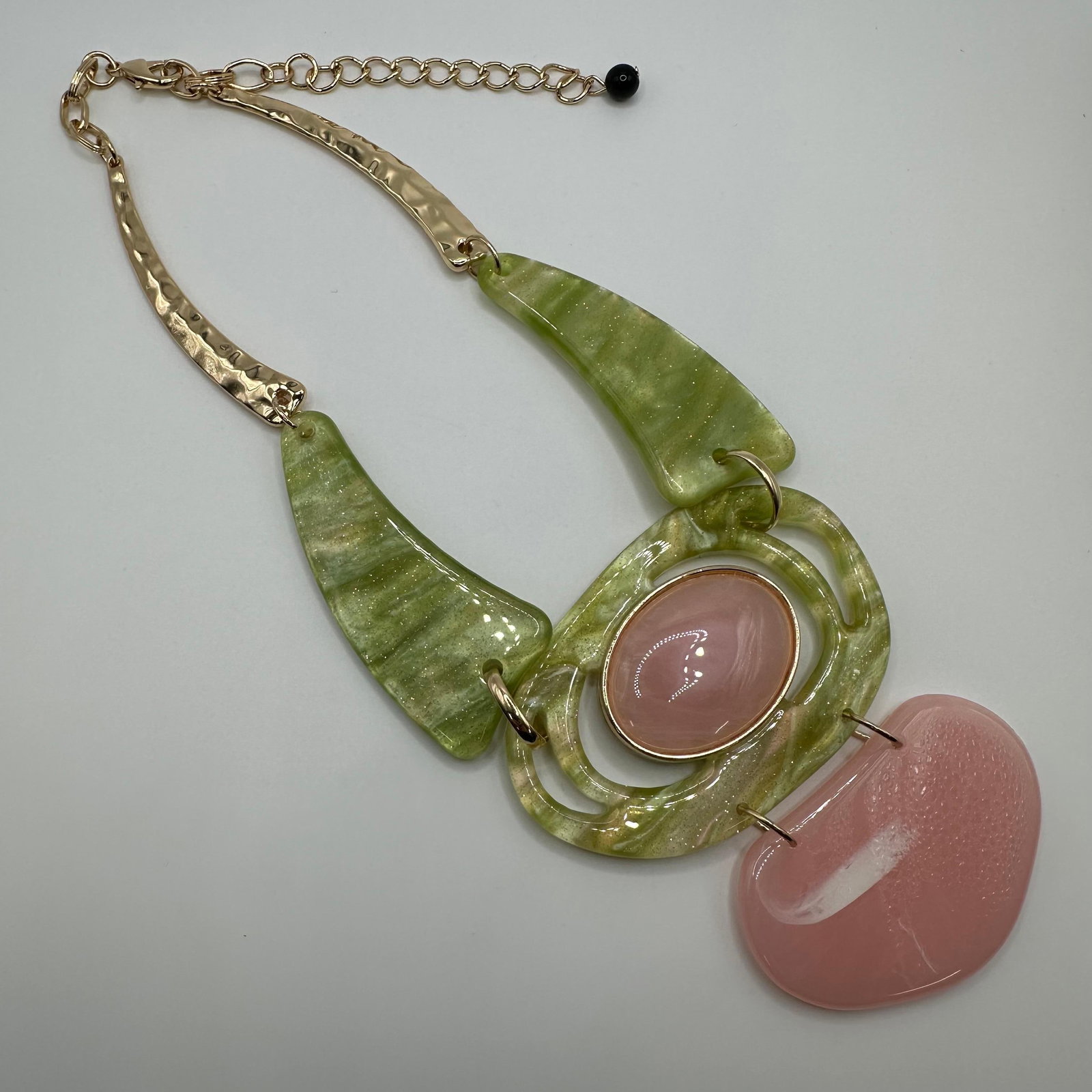 Modern Abstract Celluloid Statement Necklace Pink Green Gold-Tone: No hallmark noticed. This item is in pre-owned, previously used/displayed condition with light wear and surface scratches. Please reference all photos for full details. Measurements: 22". Weight: 