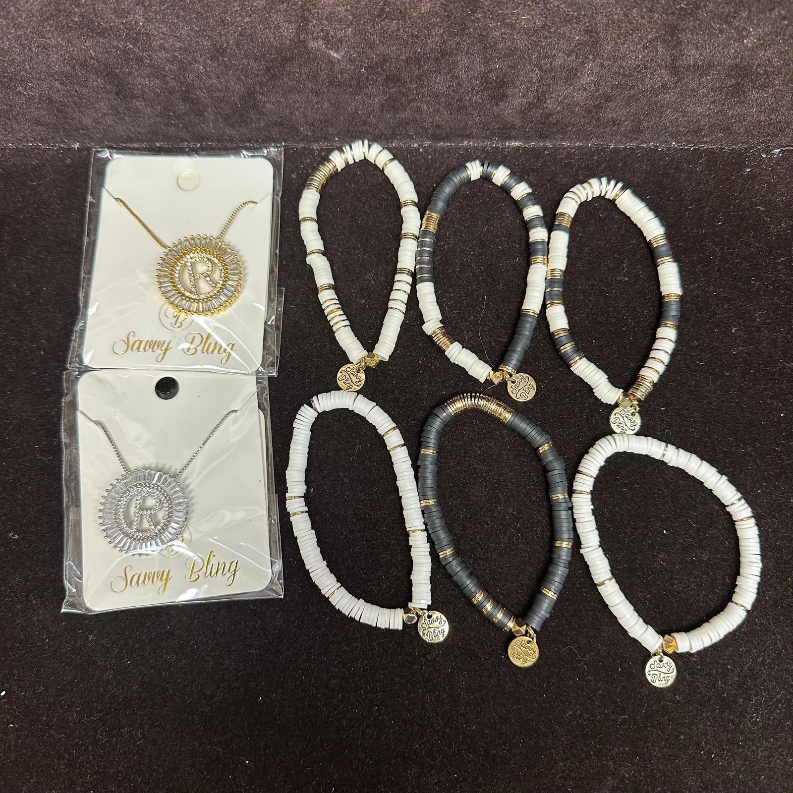 Savvy Bling Costume Jewelry Bracelet and Necklace Set of Eight: Each costume jewelry piece is marked Savvy Bling, including six bracelets and two necklaces. These items are in like-new, previously displayed condition with light wear and surface markings. Please