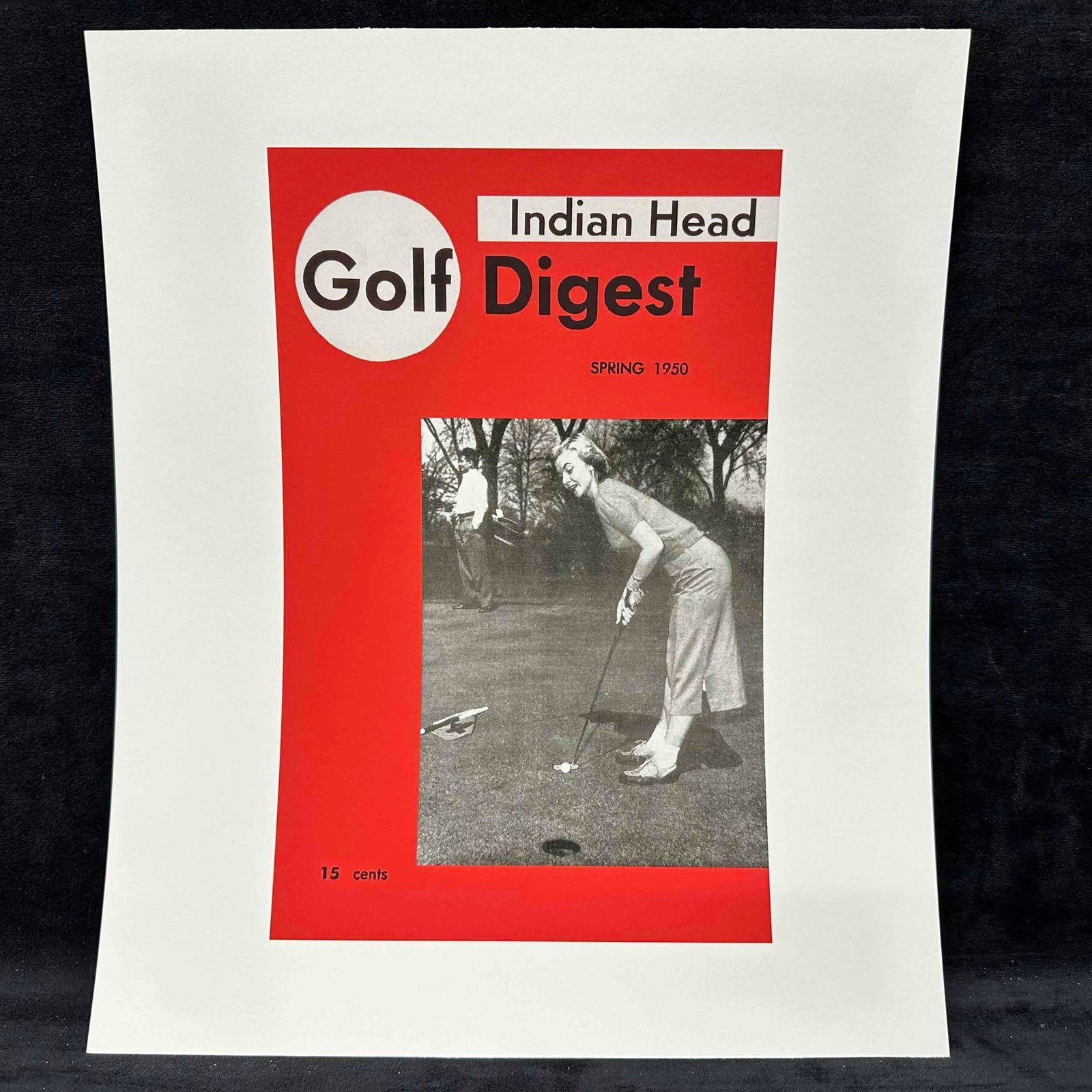 Golf Digest Indian Head Magazine Cover Reprint Spring 1950 Lithograph C: Vintage reprint of the Spring 1950 issue of Indian Head Golf Digest, featuring a black-and-white photograph of a woman golfer putting on the green, with a male golfer in the background. Cover printed 