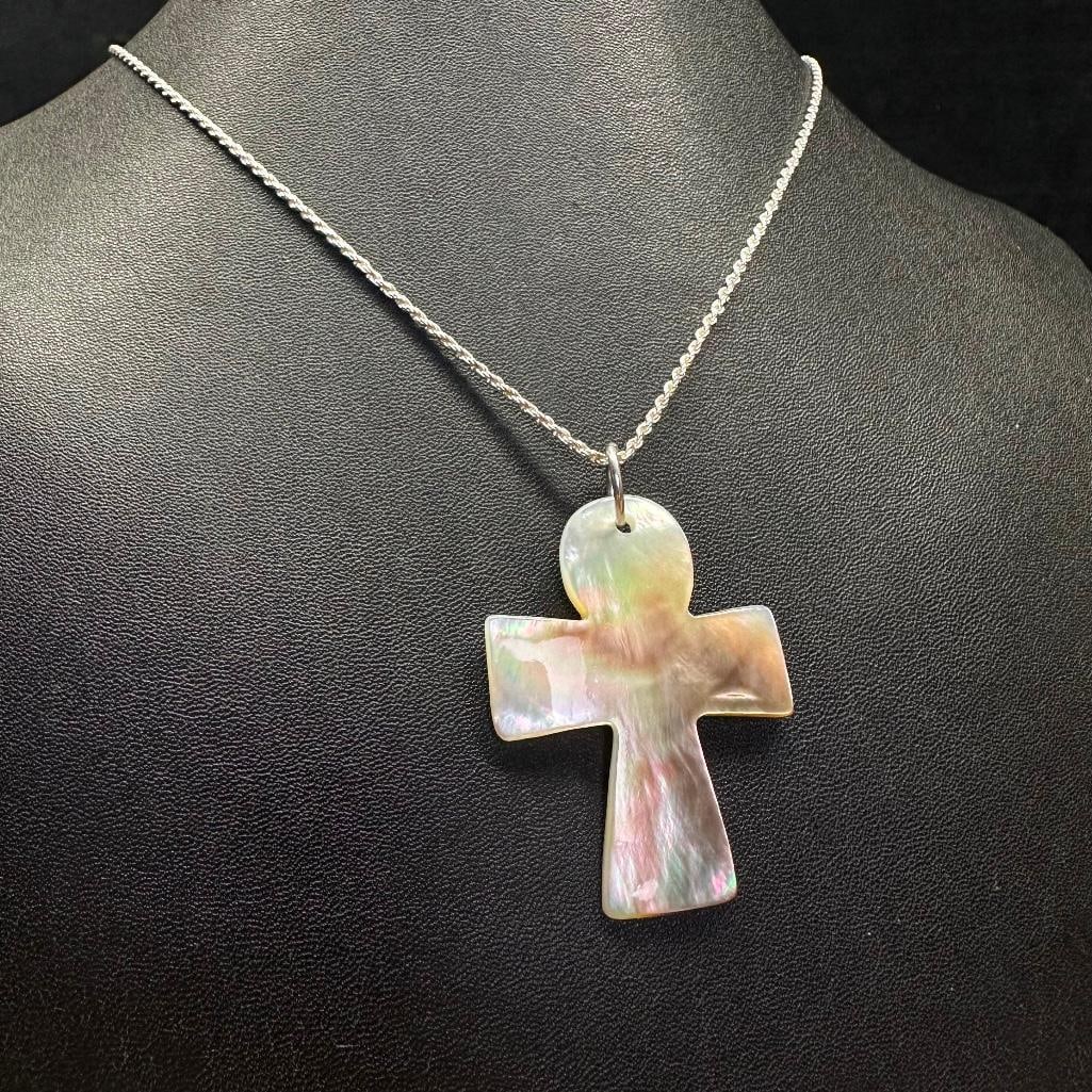 Sterling Silver Mother of Pearl Cross Pendant: This piece of jewelry has been tested and researched prior to listing. Please view all our pictures they are part of our description. DETAILS: Metal - Sterling Silver Color -Silver Stones - Mother of 