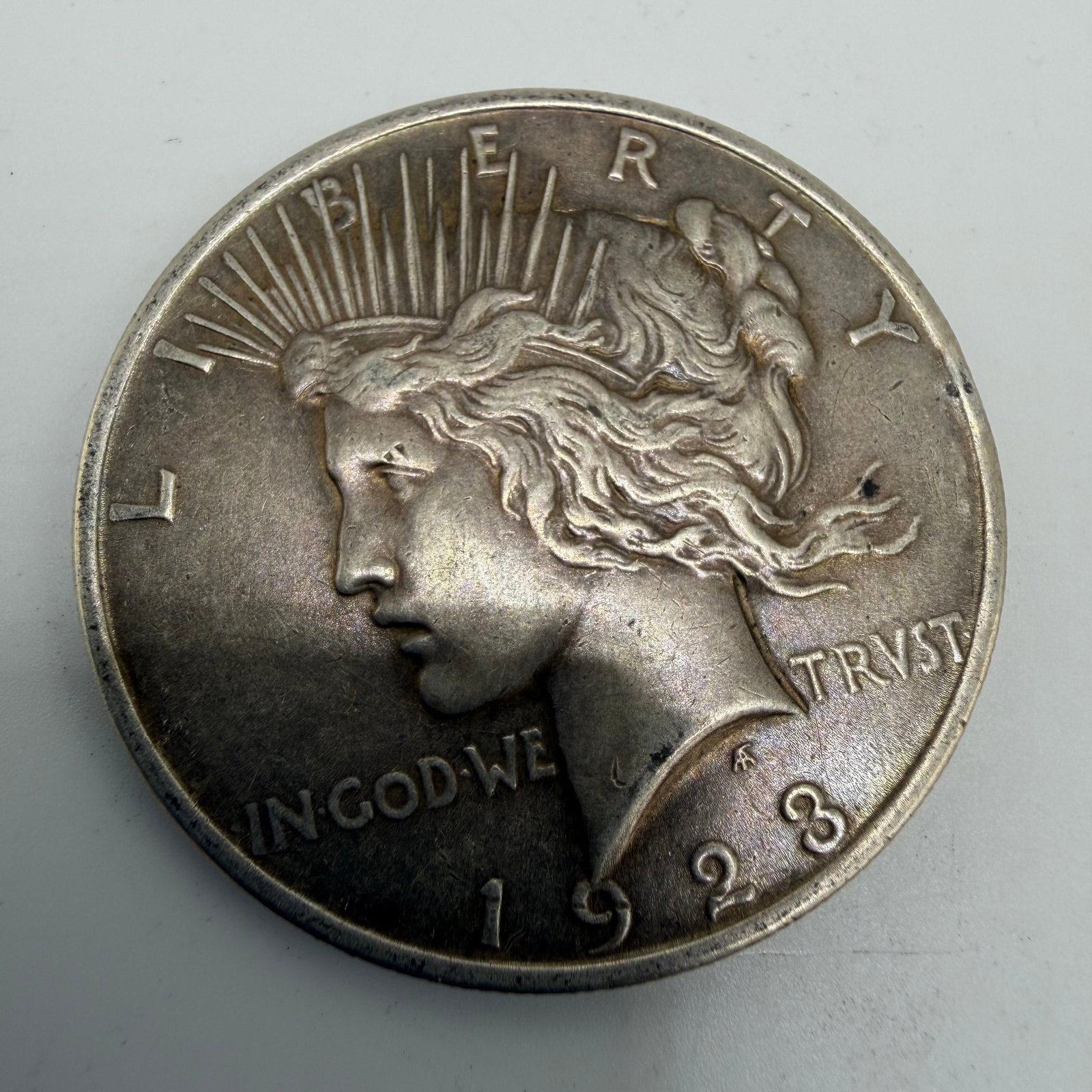 1923 Peace Dollar .900 Silver US Coin: This coin has been carefully examined and researched before listing. Please view the photos, as they are a part of the condition. DETAILS: Metal - .900 Silver Tested - Yes Size - 1.5" Weight - 26.
