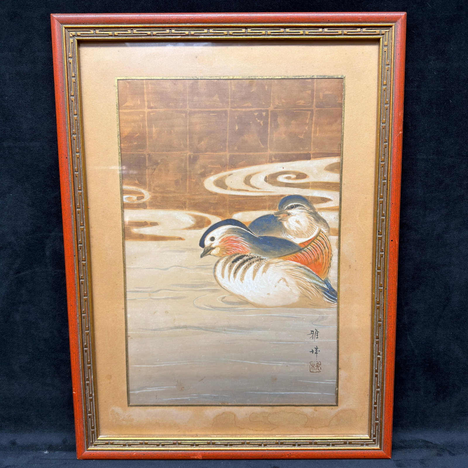 Framed Japanese Watercolor Painting of Mandarin Ducks Woodblock Style R240: A Japanese watercolor painting depicting a pair of mandarin ducks resting on calm water. Features traditional Japanese brushwork with soft earth tones and detailed plumage, and is presented in a woodb