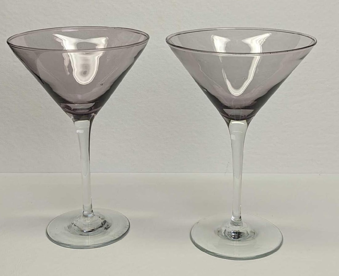 2 Vintage Glass Martini Glasses A: 2 Vintage Glass Martini Glasses A. The maker and date of creation are unknown. Each glass is approx 4 3/4" x 4 3/4" x 7" and the total weight is 0.85lb. The glasses have no chips or cracks. There are 