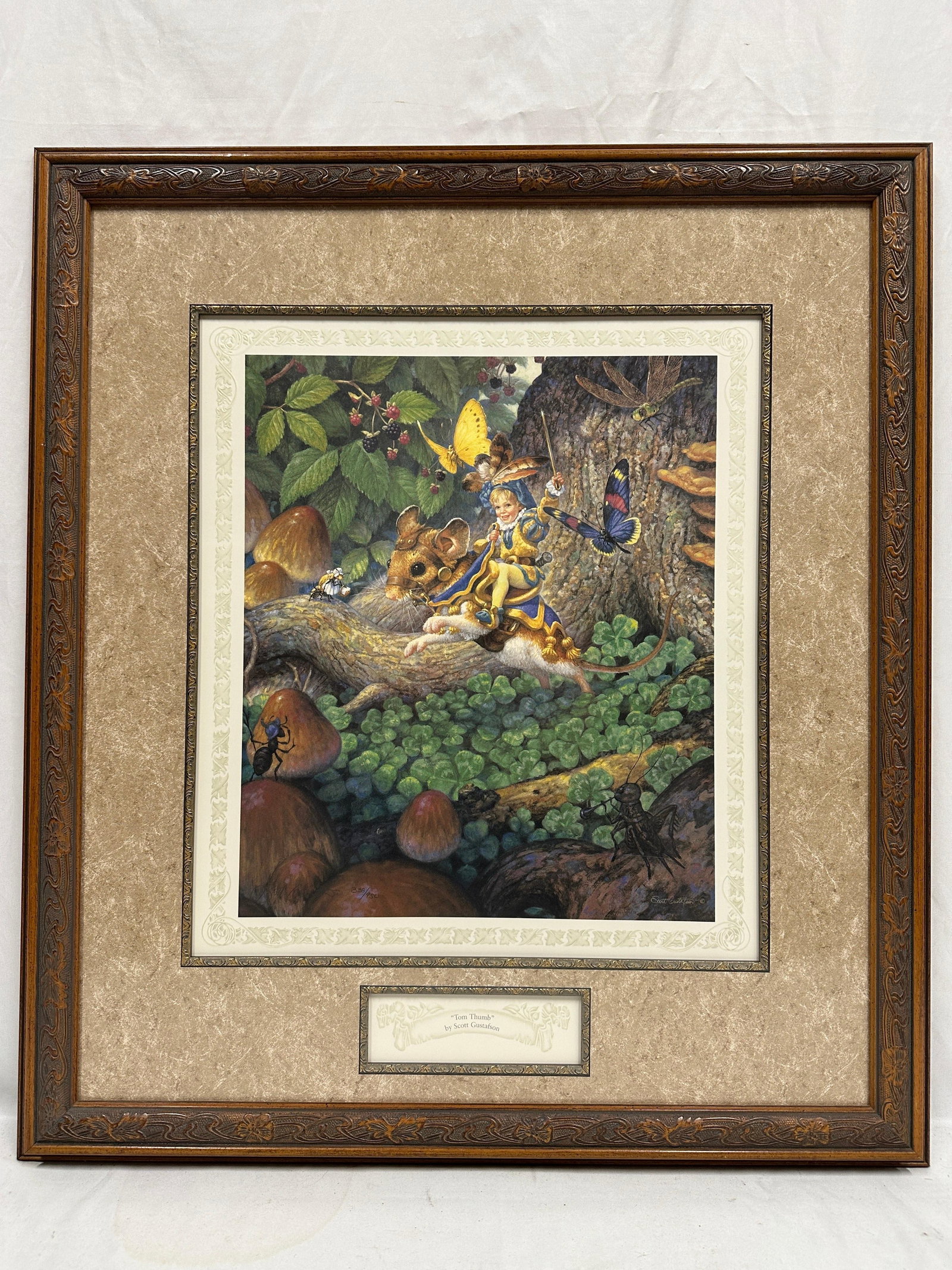 Scott Gustafson Tom Thumb Signed and Numbered Limited Edition Print Framed: Framed limited edition art print titled Tom Thumb by acclaimed fantasy and children's book illustrator Scott Gustafson. The artwork depicts the classic fairy tale character riding atop a mouse thr