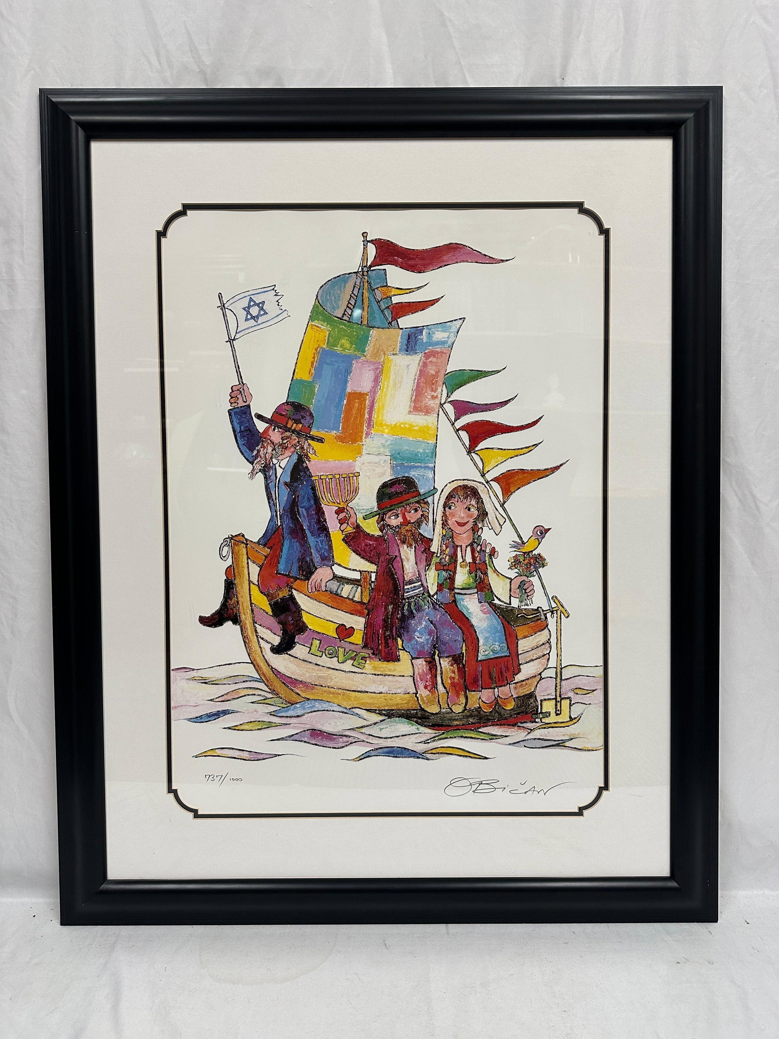 Jovan Obican Limited Edition Judaica Signed Voyage of Love 737/1000 Litho Framed: Limited edition signed and numbered lithograph print by renowned Croatian-Israeli artist Jovan Obican (1918-1986), titled Voyage of Love. The whimsical Judaica composition depicts a family aboard a co