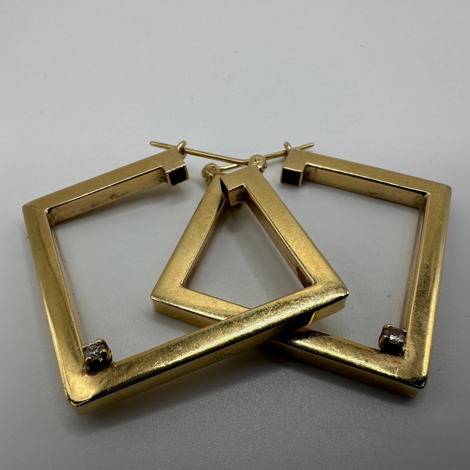 Tubular Square Geometric Style Hoop Earrings 14K Accent Diamond: This item is in good pre-owned condition, previously used/displayed, with noticeable light wear and surface scratches. Please reference all photos for full details. This piece of jewelry has been care