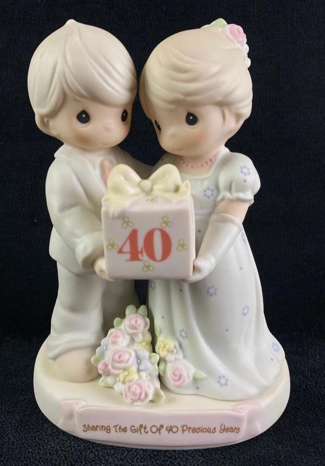 Precious Moments Figurine "40 Precious Years": Precious Moments Figurine "40 Precious Years" 40th wedding anniversary figurine from Precious Moments. The title is "Sharing the Gift of 40 Precious Years". It shows two figures holdin