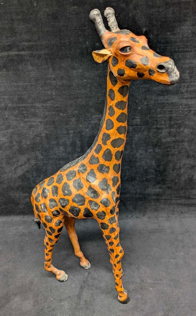 Vintage Paper Mache Leather 23" Giraffe Figurine: Vintage Paper Mache Leather 23" Giraffe Figurine. This is 23" x 13" x 5" and it weighs 1.87lb. The figurine has some markings and signs of wear. Please see the images as they are part of the descripti