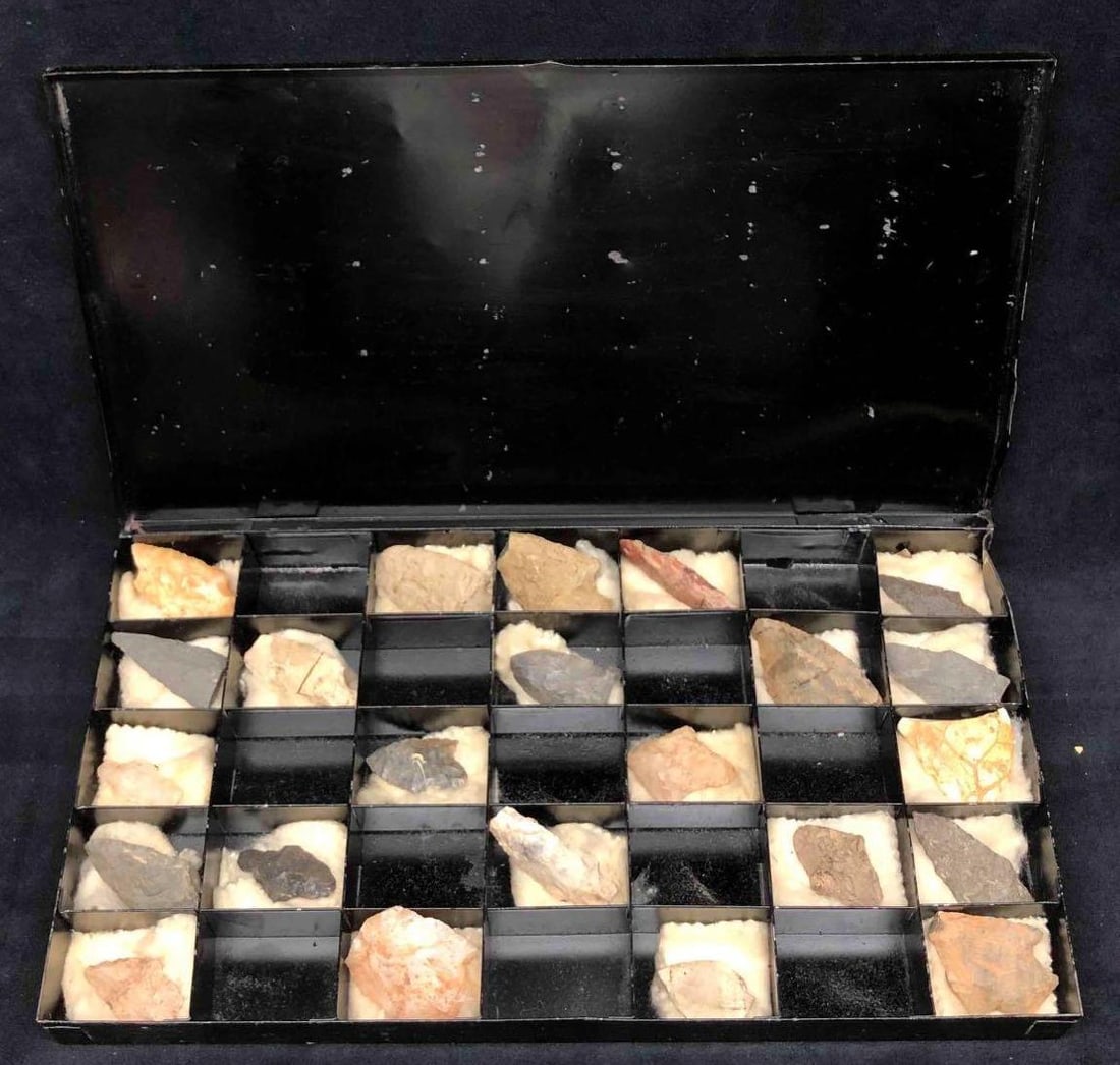23 Native American Arrow Heads: This lot contains 23 Native American Arrow Heads. The Arrow Heads come in a protective case with cloth under each for preservation. The box is approx 14 1/4" x 7 3/4" x 1 1/4" and together the box and