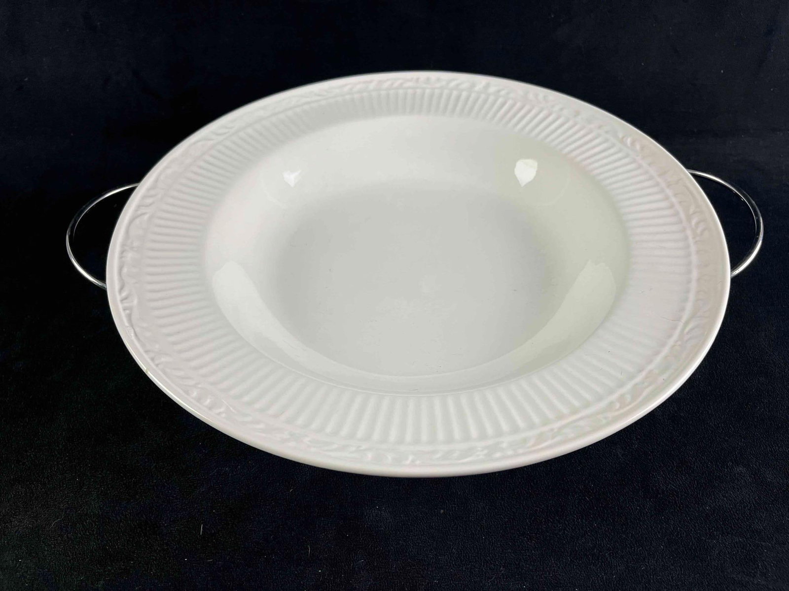 Large Ceramic Bowl with Serving Stand: Large Ceramic Bowl with Serving Stand This is a large bowl with a serving stand by the brand International. This bowl has an imprinted decorated rim and sits on top of a metal rack. These items are in