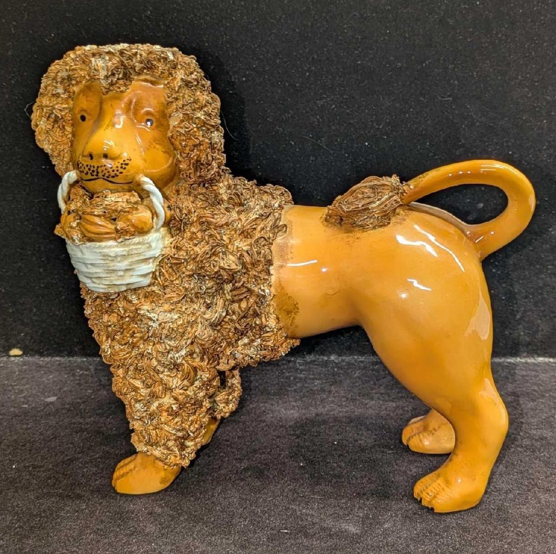 Vintage Italian Ceramic Lion With Basket Figurine B: Vintage Italian Ceramic Lion With Basket Figurine B. This is approx 7 1/4" x 4" x 7 1/2" and it weighs 1.27lb. The figurine has some color loss and markings. Please see the images as they are part of 