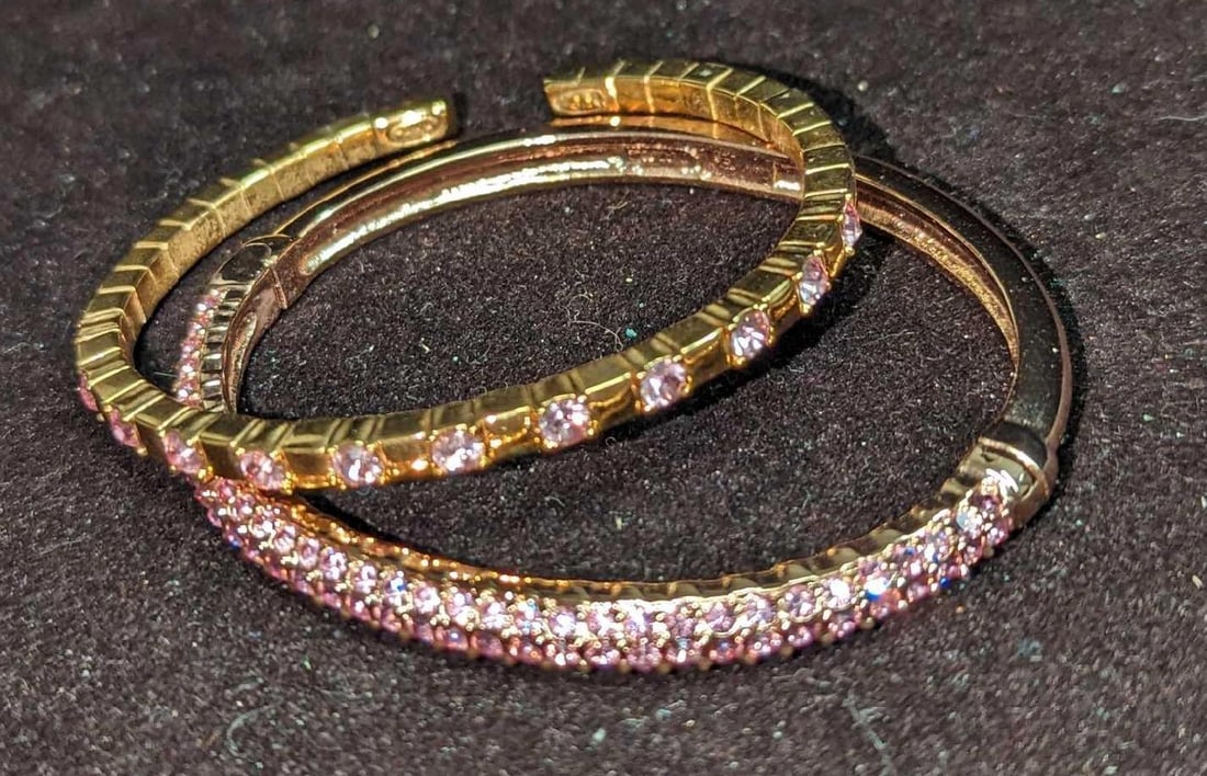 Norman Miller & Unmarked Gold Plated Bracelets: Norman Miller & Unmarked Gold Plated Bracelets. This lot includes: (1) Gold Plated Flexible Bracelet With Pink Rhinestones. This is approx 2 1/2" x 1/8"x 2 1/8". (1) Norman 