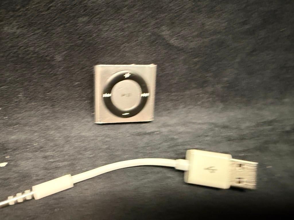 4th Final Gen iPod Shuffle: 4th Final Gen Apple iPod Shuffle Untested iPod Shuffle from Apple, in silver. Has a 2gb capacity and comes with a charging/sync cable for charging and putting music on. Has not been tested, but i