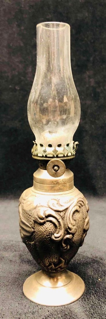 Silver Plated Miniature 19th Century Oil Lamp With Metal Base: This lot contains a Silver Plated Miniature 19th Century Oil Lamp With Metal Base. It is approx 2" x 2" and it weighs about 0.8lbs. Overall the Miniature Oil Lamp is in good used condition with some