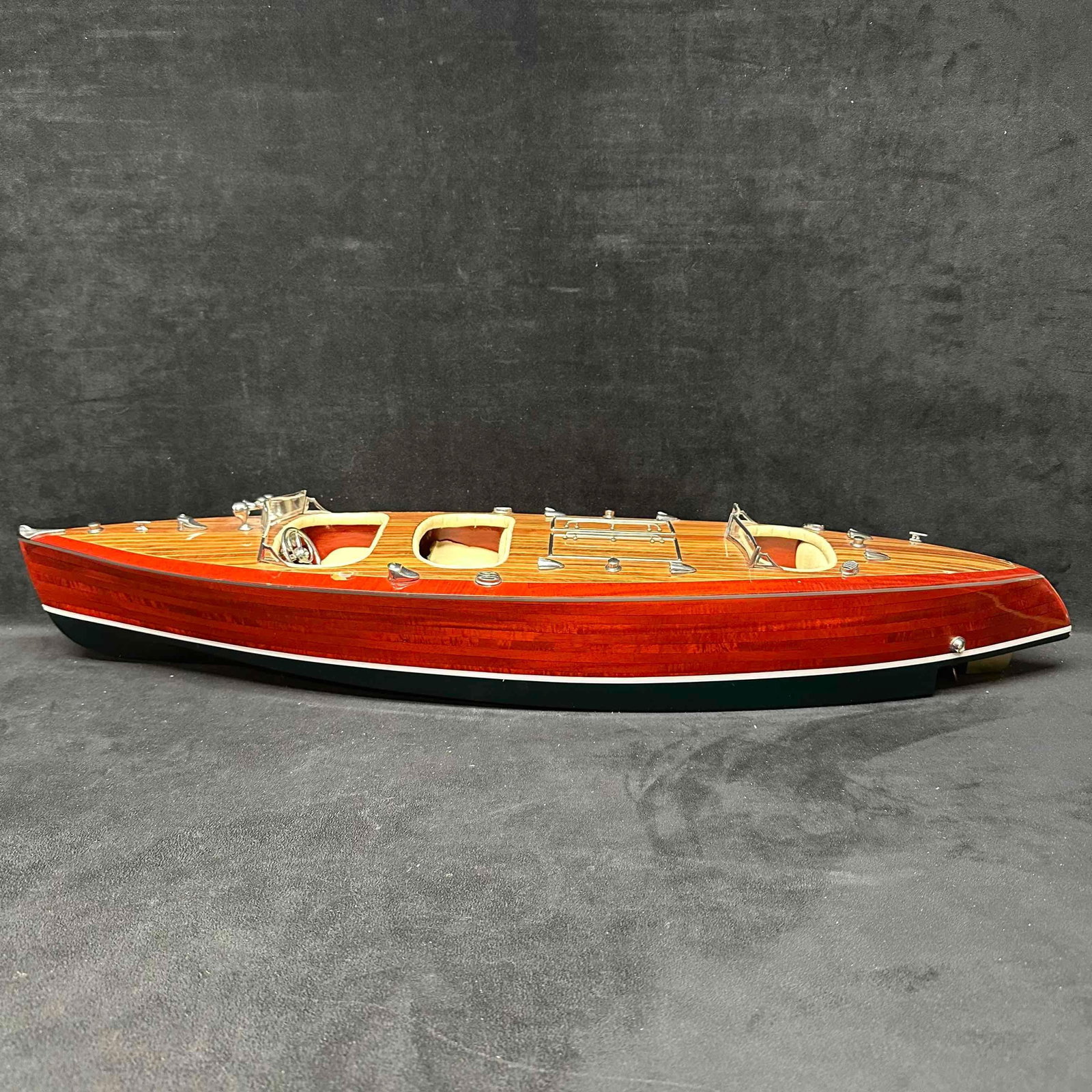 Handcrafted Chris Craft Triple Cockpit Model Wooden Boat: A few pieces are missing, some have fallen off, broken in need of repair. 100% Handcrafted from Mahogany with Intricate Detailing. Premium detailing such as leather and brass accents are featured on t
