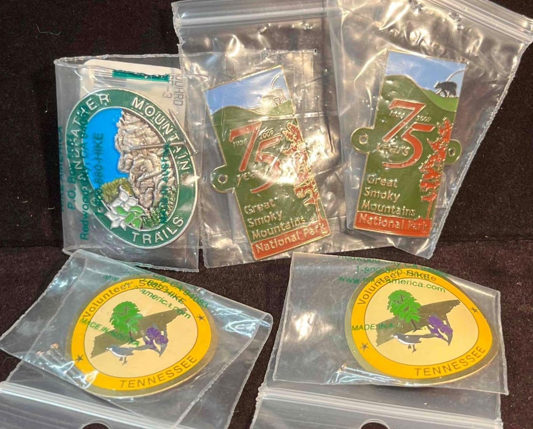 Bundle Of Five Hiking Stick Medallions (F18): This lot contains a Bundle Of Five Hiking Stick Medallions (F18). The Medallions fit together in a small 6 3/4" x 4 1/4" plastic bag and altogether they weigh about 0.04lbs. Overall the Hiki