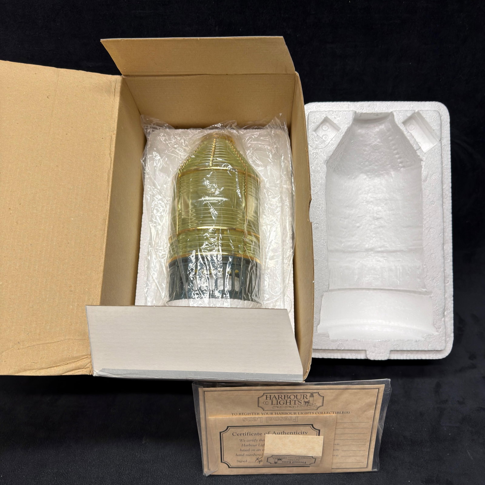 Harbour Lights Fresnel Lens Lighthouse Replica 3rd Order #651: This detailed lighthouse-optic collectible features translucent molded lenses with a metal framework and display base. Good pre-owned, like new with original box, previously displayed condition with l