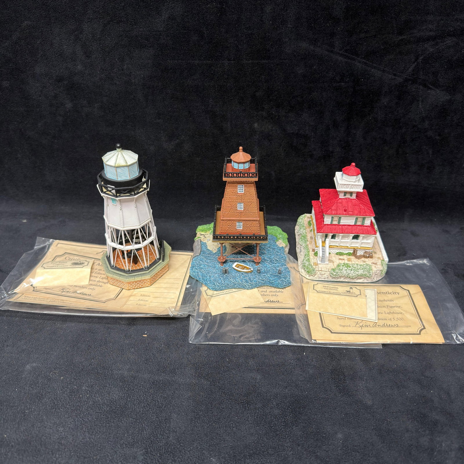 Louisiana California Harbour Lights Lighthouse Figurines Three Southwest Reef: Group of three Harbour Lights collectible lighthouse figurines, including Fort Point, California #541 Society Exclusive; Southwest Reef, Louisiana #530 Society Exclusive; and New Canal, Louisiana #418