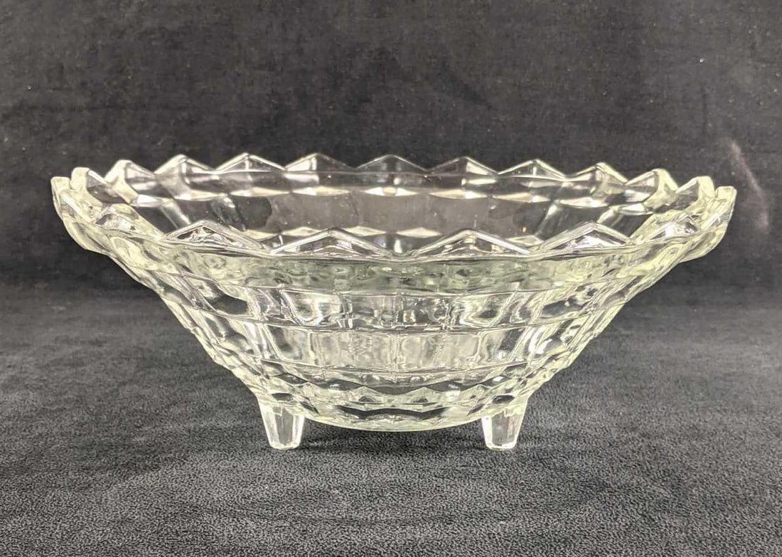 Elegant Glass Bowl With Feet: Elegant Glass Bowl With Feet This beautiful glass bowl is in great condition with minimal scratches. It has a cubist design and is elevated by its glass feet. This is a wonderful decoration with no kn