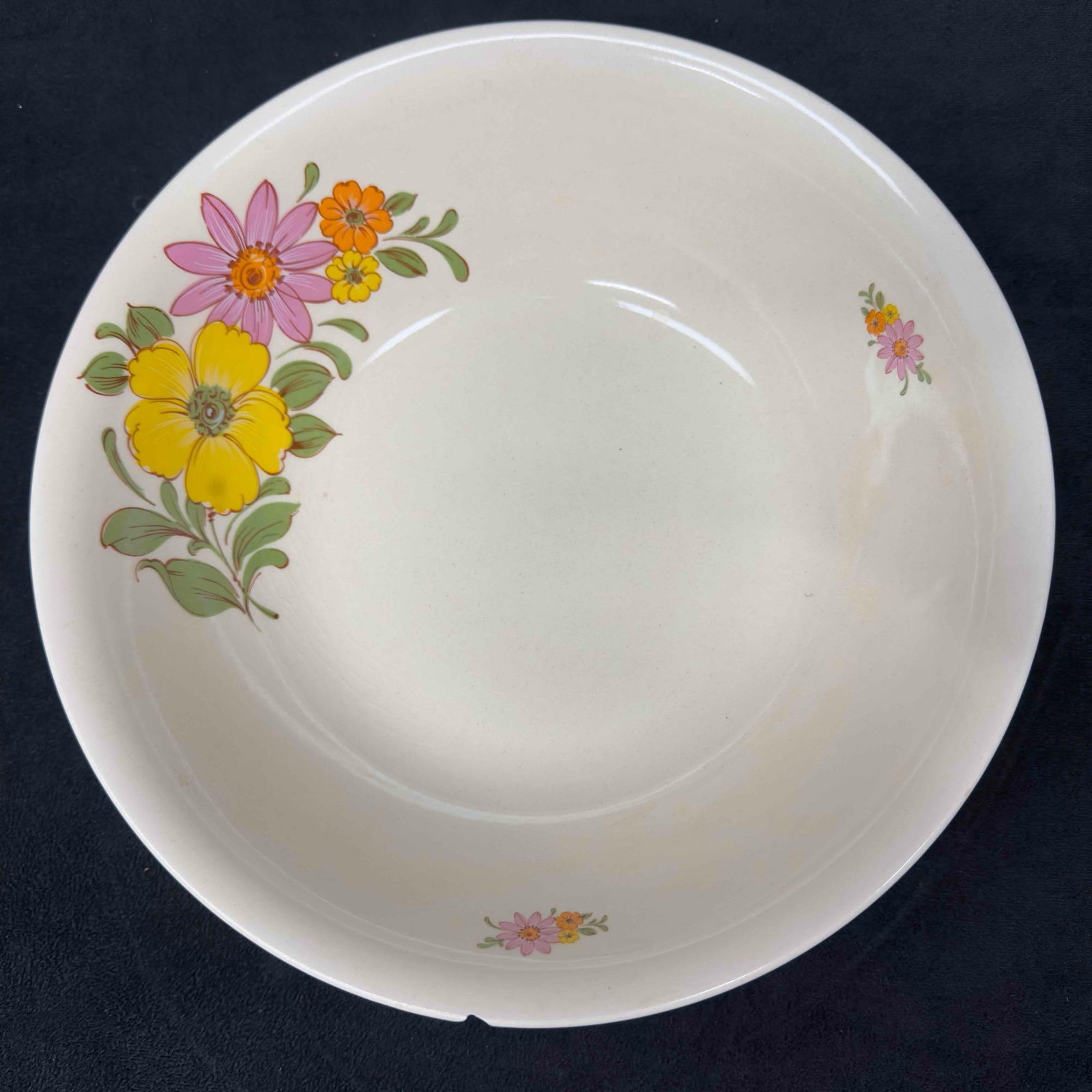 FS Made in Romania Yellow Flowers Large Serving Bowl: FS Made in Romania Bowl Yellow Flowers Large Serving Bowl. This serving bowl has a beautiful floral design with yellow, pink, orange flowers, and green leafs. Small chip on the rim, no other breaks or