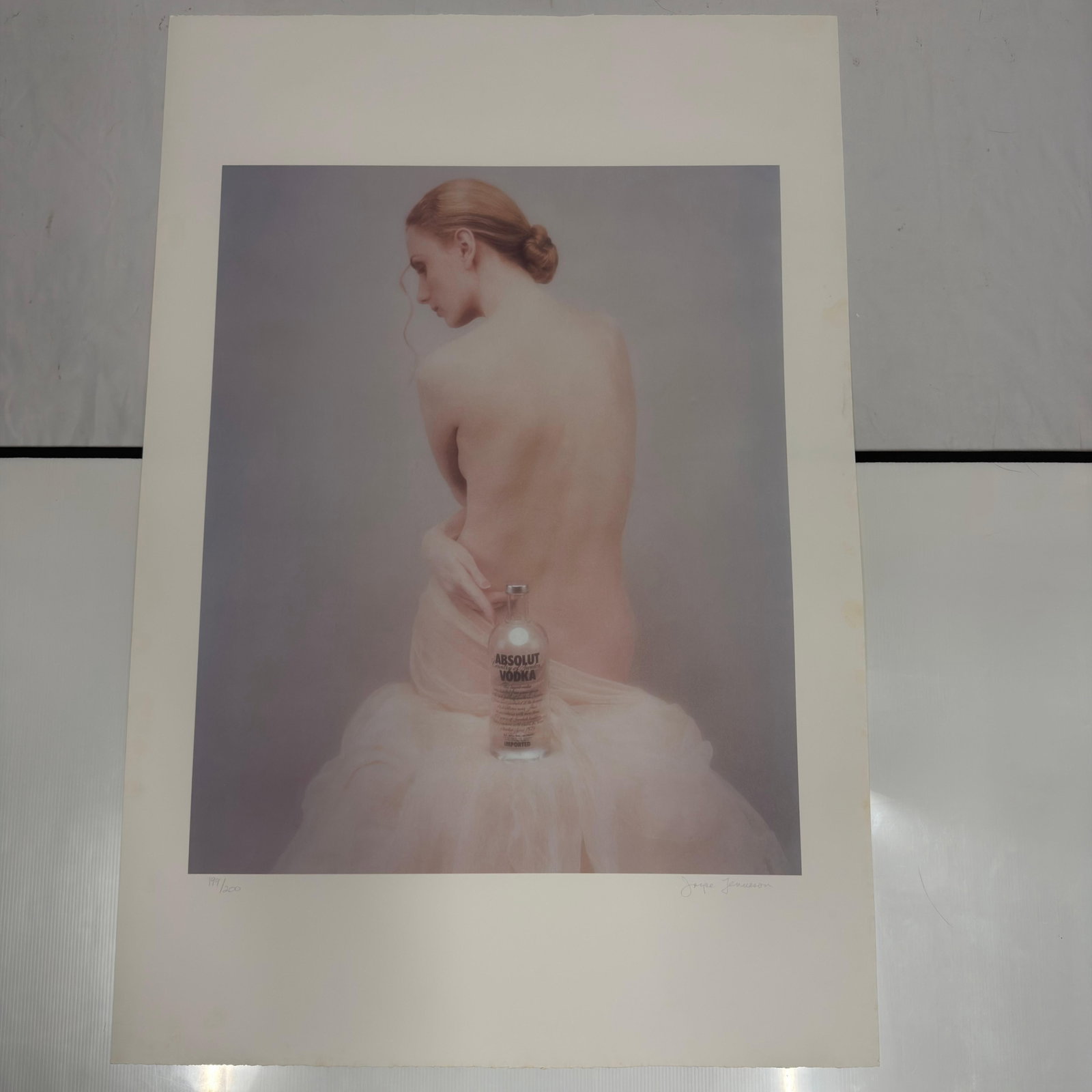 Absolut Vodka Joyce Tenneson Print Signed and Numbered 199 of 200: Limited edition signed and numbered art print by noted photographer/artist Joyce Tenneson featuring a female figure posed with an Absolut Vodka bottle. Pencil-signed and numbered 199/200.