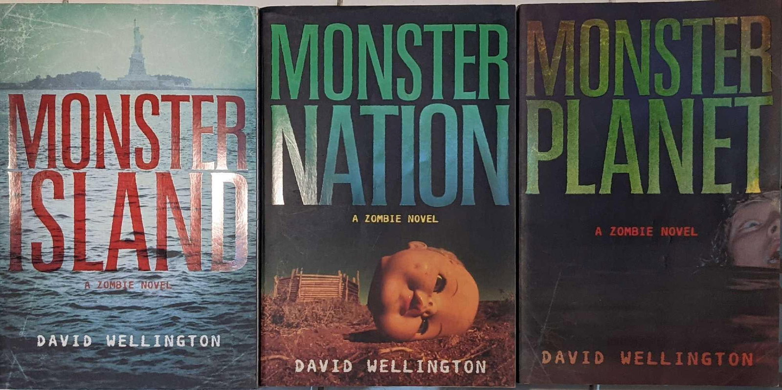 Monster Island Zombie Trilogy Paperbacks: This lot includes: (1) Monster Island By David Wellington. Was published by Thunder's Mouth Press in 2006. New York. (1) Monster Island By David Wellington. Was published by Thunder's Mouth Pr