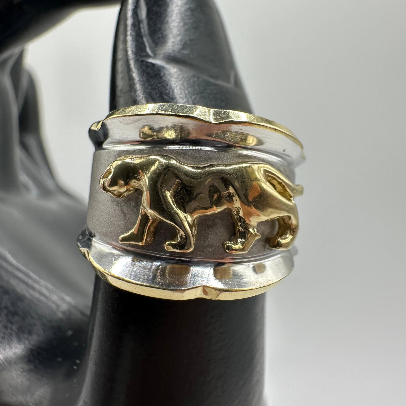 14K Walking Panther Motif White Yellow Gold Two Tone Ring: This item is in good pre-owned, previously used/displayed condition with noticeable light wear and surface scratches. Please reference all photos for full details. This piece of jewelry has been teste