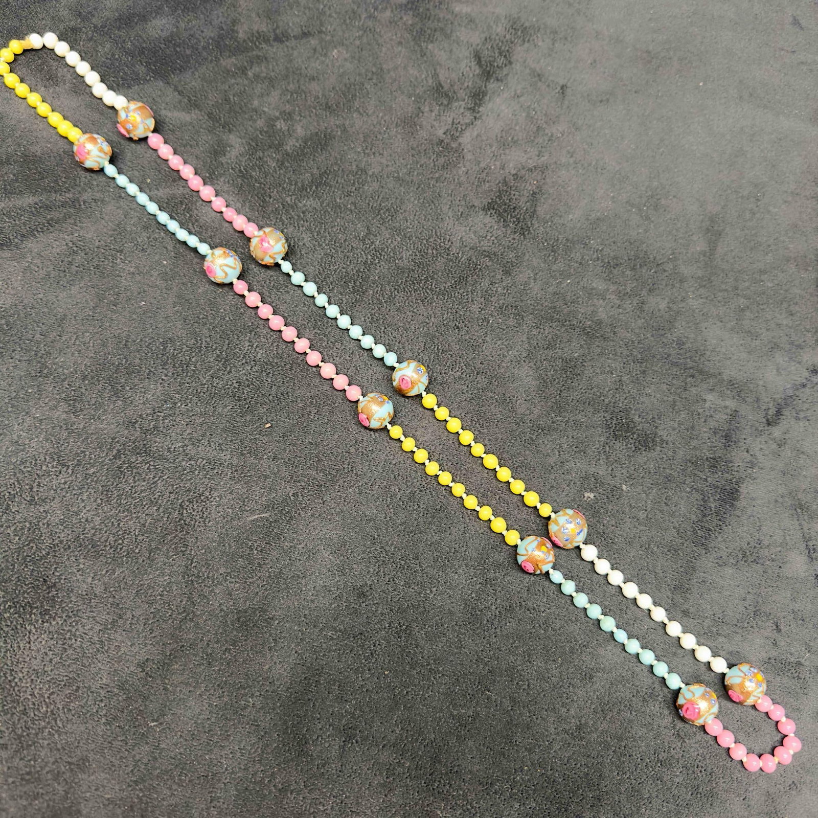 Venetian Murano Art Glass Lamp Work Light Blue Round Bright Pink Yellow White Beaded Necklace E37: Venetian Murano Art Glass Lamp Work Light Blue Round Bright Pink Yellow White Beaded Necklace E37. Necklace with light blue glass beads with beautiful hand painted designs on each. The necklace featur