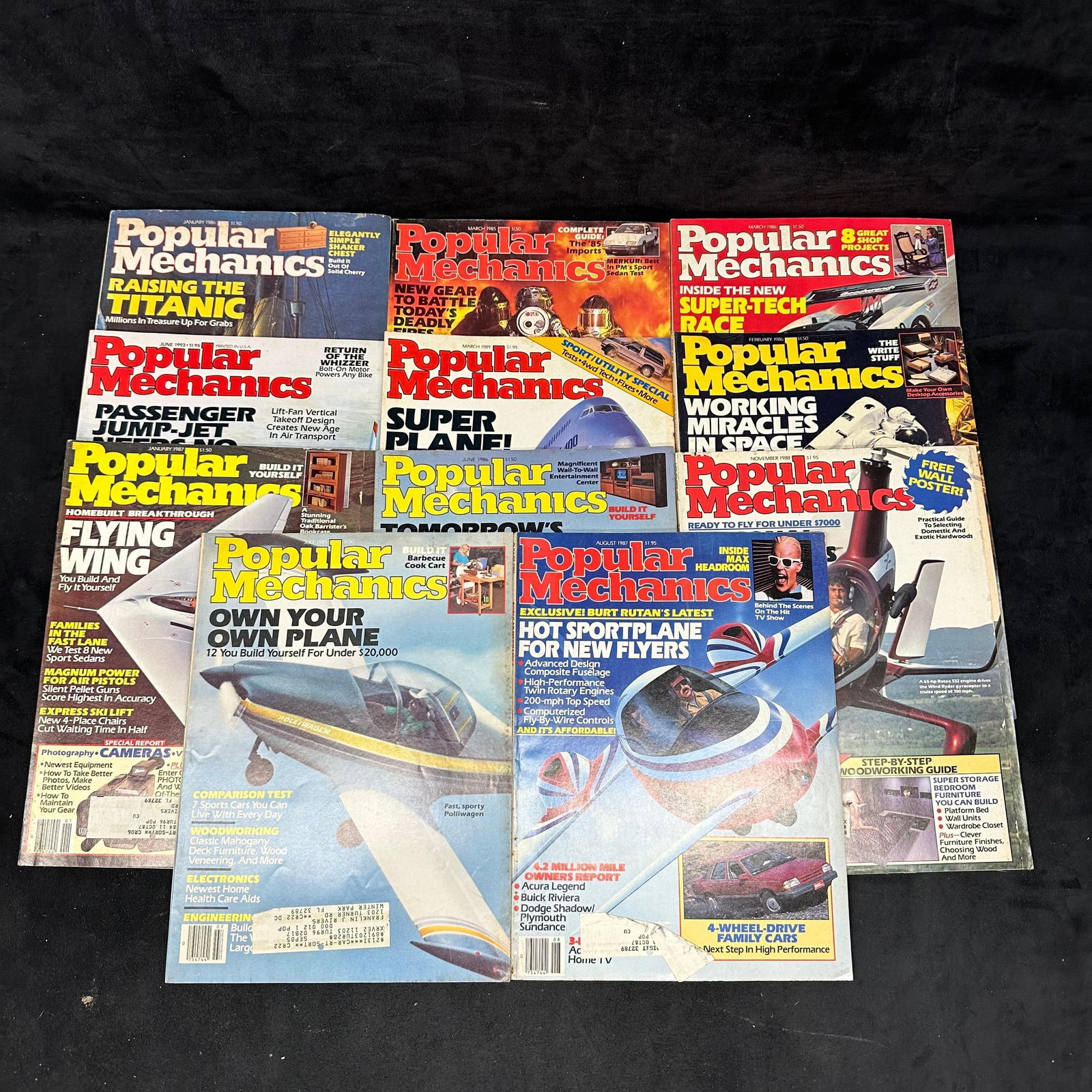 Popular Mechanics Magazine Lot 1980s 1990s Eleven Issues: Vintage lot of eleven Popular Mechanics magazines from the 1980's and 1990's. Each magazine shows light wear with some creases, torn pages, rips, marked-up pages, front or back covers mis