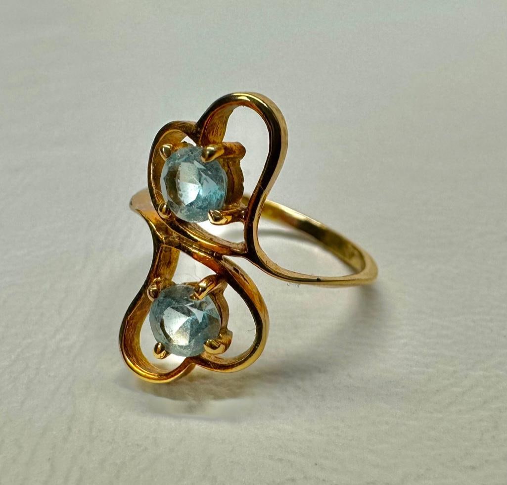 14k Gold & Topaz Double Heart Ring: This piece of jewelry has been tested and researched prior to listing. Please view all our pictures they are part of our description. DETAILS: Metal - 14k Gold Color - Yellow Gold Stones - Blue Topaz 