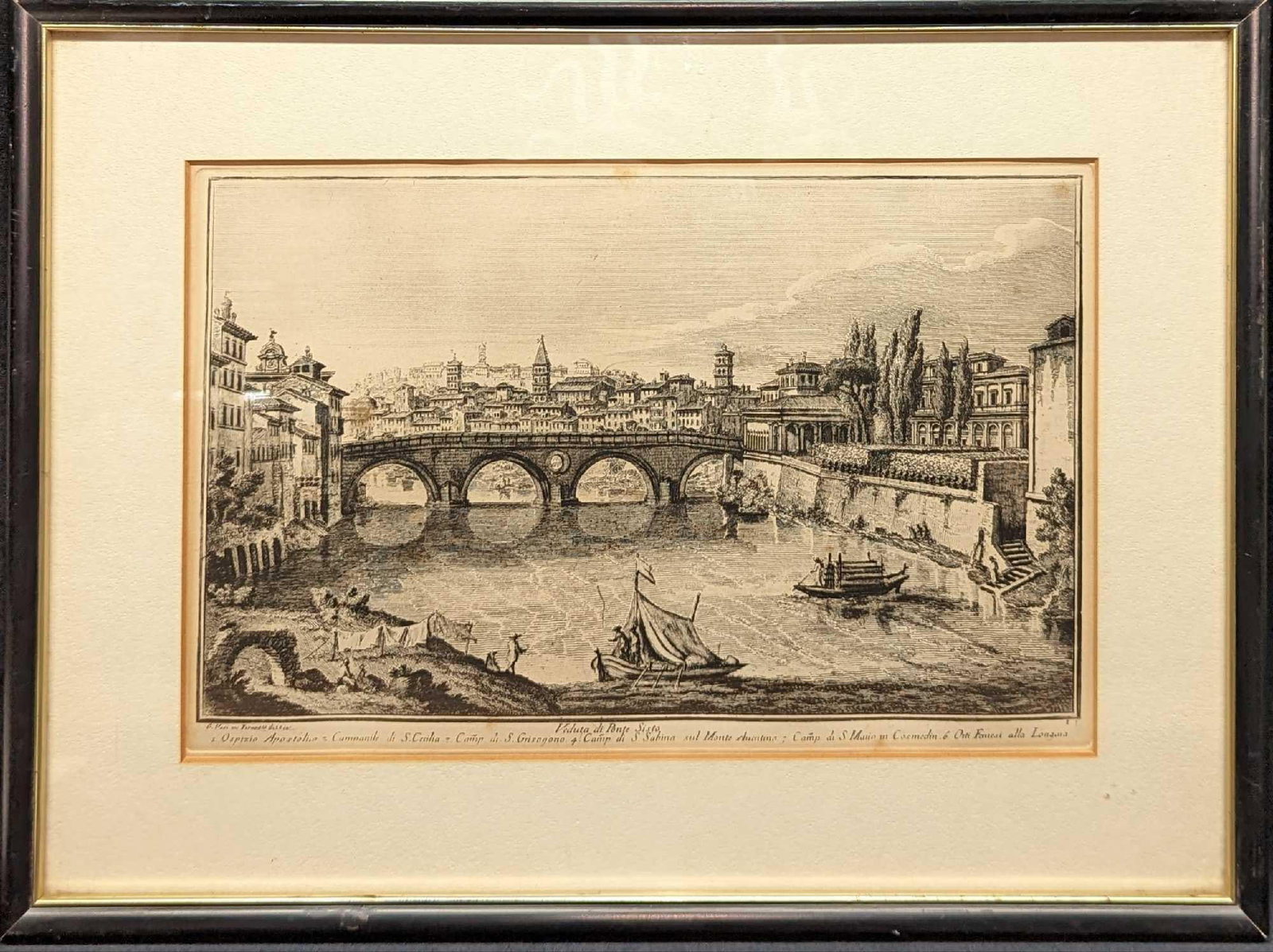 Framed Vintage Guiseppe Vasi Veduta Di Ponte Sisto Engraving: Framed Vintage Guiseppe Vasi Veduta Di Ponte Sisto Engraving. This print shows a view of Ponte Sisto, a bridge in Rome’s historic centre, spanning the river Tiber. This framed print is appr