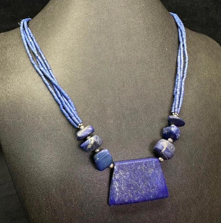 Lapis Beaded Necklace W/ Large Center Piece: This piece of jewelry has been tested and researched prior to listing. Please view all our pictures they are part of our description. DETAILS: Metal - Silverplate Color - silver Stones - Lapis Lazuli 