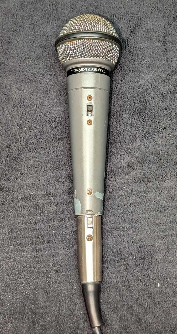 Realistic Highball 33-984C Dynamic Microphone: Realistic Highball 33-984C Dynamic Microphone. This line of microphones were originally made by Shure and rebranded to sell in Radio Shack in the 90s. This wired microphone is approx 2 1/4" x 2 1