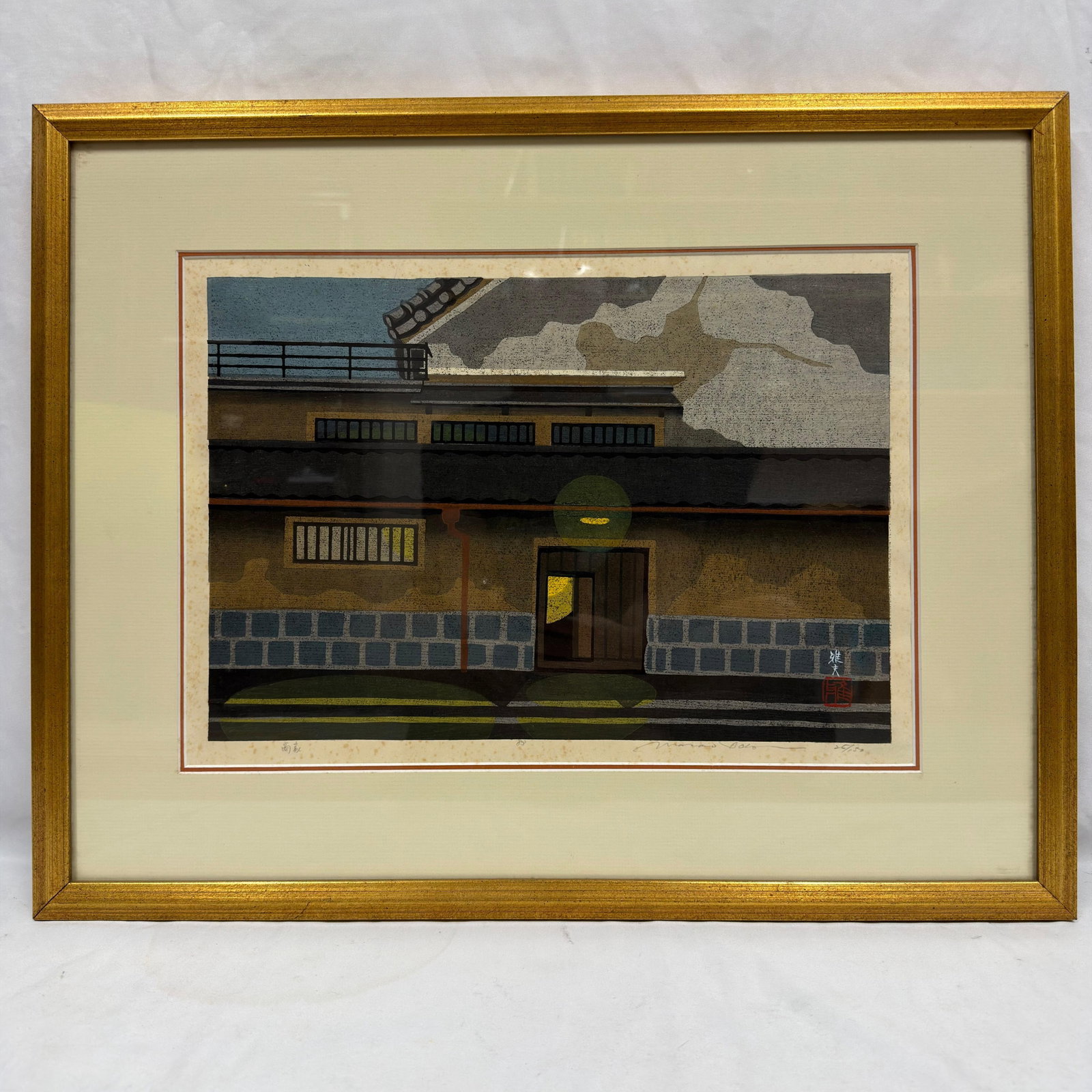 Masao Ido Signed and Numbered Japanese Woodblock Print 26/150: Original color woodblock print by Masao Ido, Japanese, 1945–2016, depicting a traditional Japanese streetscape with an illuminated doorway. Pencil signed Masao Ido lower right and numbered 26/15
