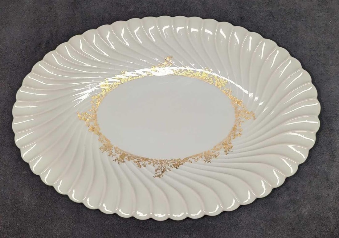 Retired Haviland Ladore 15" Oval Serving Platter: Retired Haviland Ladore 15" Oval Serving Platter. This Gold on White series of fine china was released in 1962 - 1988. The serving platter is approx 15 3/4" x 10 3/4" x 1 3/4" and it weighs 2.83lb. Th
