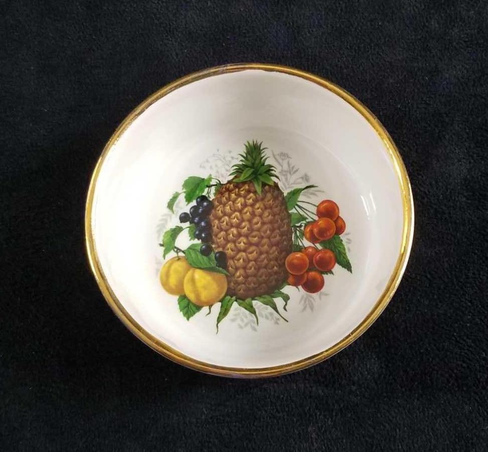 Darthmoth Elsenham Fruit Dessert Bowl England: The bowl is ceramic, white, with a pineapple and assorted fruit design on the center, and has gold gild. Made by Dartmouth Potteries in England specific for Elsenham Jam. Can be used as