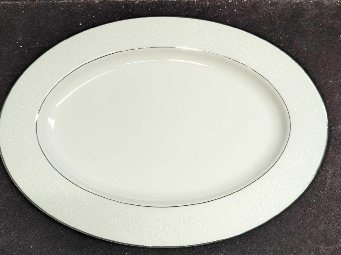 Retired International Juliet 12" Oval Serving Platter: Retired International Juliet 12" Oval Serving Platter. Made of fine china. This is approx 12 3/8" x 9" x 1" and it weighs 1.59lb. The platter has no chips or cracks.