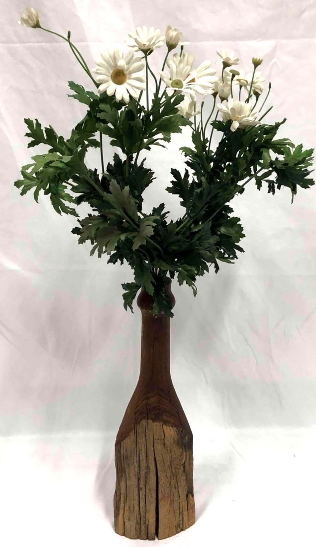 Vintage Vase Carved From Wood: This lot contains a vintage vase carved from wood. This rustic piece is the perfect natural decor to bring outdoor elements into interior design. This vase is approx 14 3/4" x 4 1/2" and weighs