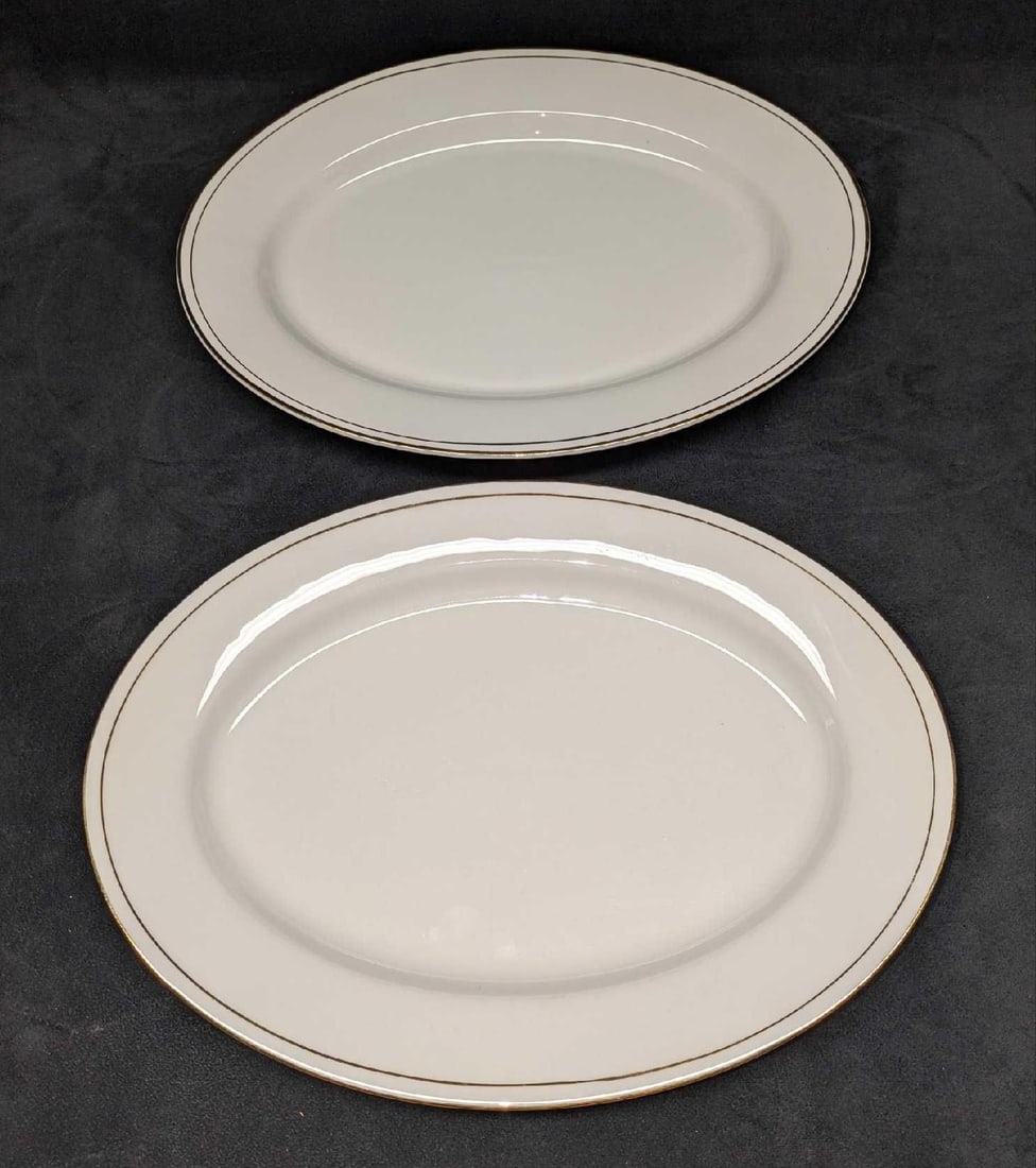 2 Retired China Pearl Luxury 14" Oval Serving Platters: 2 Retired China Pearl Luxury 14" Oval Serving Platters. This series was released from the year 1995 to the year 2004. Each of the platter is approx 14 1/4" x 10 5/8" x 1/2" and the total weight is