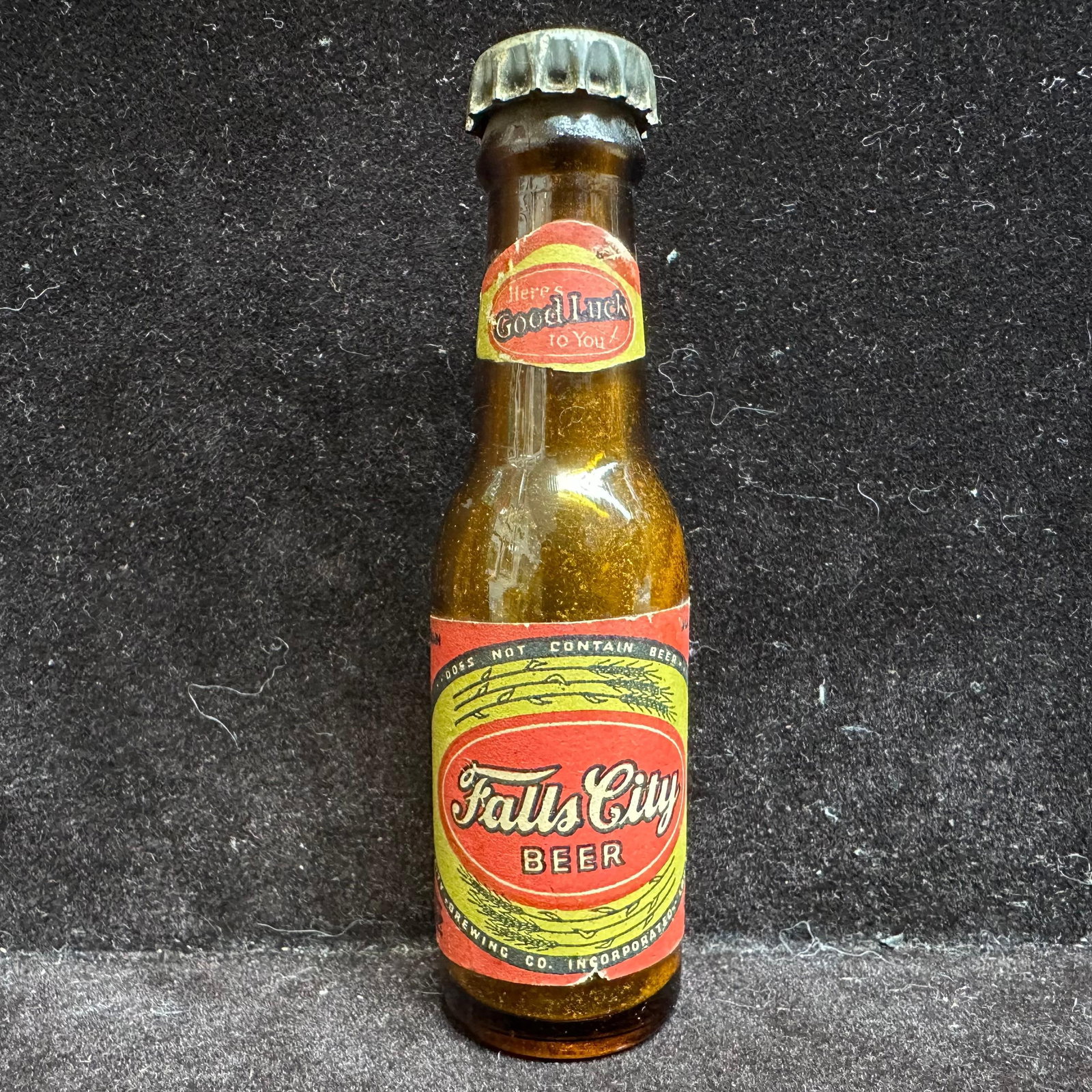 1950's Falls City Beer Mini Beer Bottle Louisville Kentucky Souvenir: A 1950s Falls City Beer mini bottle from Louisville, KY, is a collectible breweriana item, representing the famous local brewery and sold as a nostalgic souvenir. This item is in pre-owned, previously