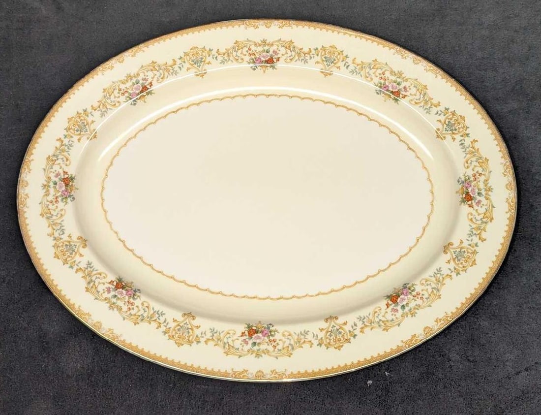 Retired Noritake Blossom Time Ivory China 16" Oval Serving Platter: Retired Noritake Blossom Time Ivory China 16" Oval Serving Platter. This is approx 16 1/4" x 12" x 1 5/8" and it weighs 3.82 lbs. There is a chip on the back of the platter. Please see the images as