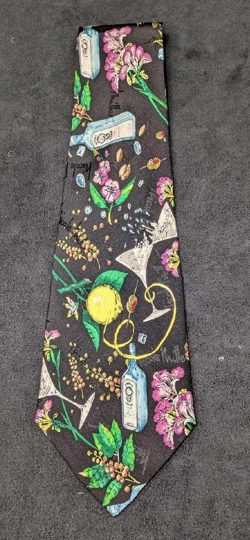 Bombay Gin Nicole Miller Silk Tie: Bombay Gin Nicole Miller Silk Tie. This was dated 1997. Comes in its original clear package that is approx 4 1/4" x 16" and it weighs 0.06lb. The tie does not appear to have been worn.