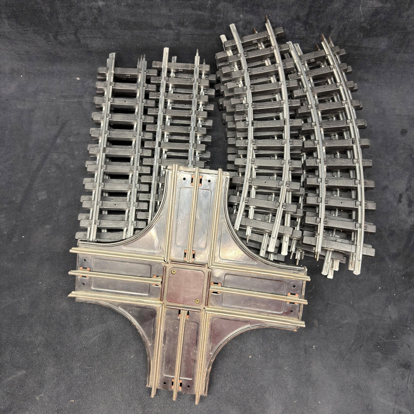 Bachmann G Scale Train Track and Lionel Railroad Crossing Lot: Assorted large-scale model railroad track, including Bachmann straight and curved track sections, along with a vintage Lionel Corporation four-way railroad crossing marked Made in U.S.A. Pre-owned, wi