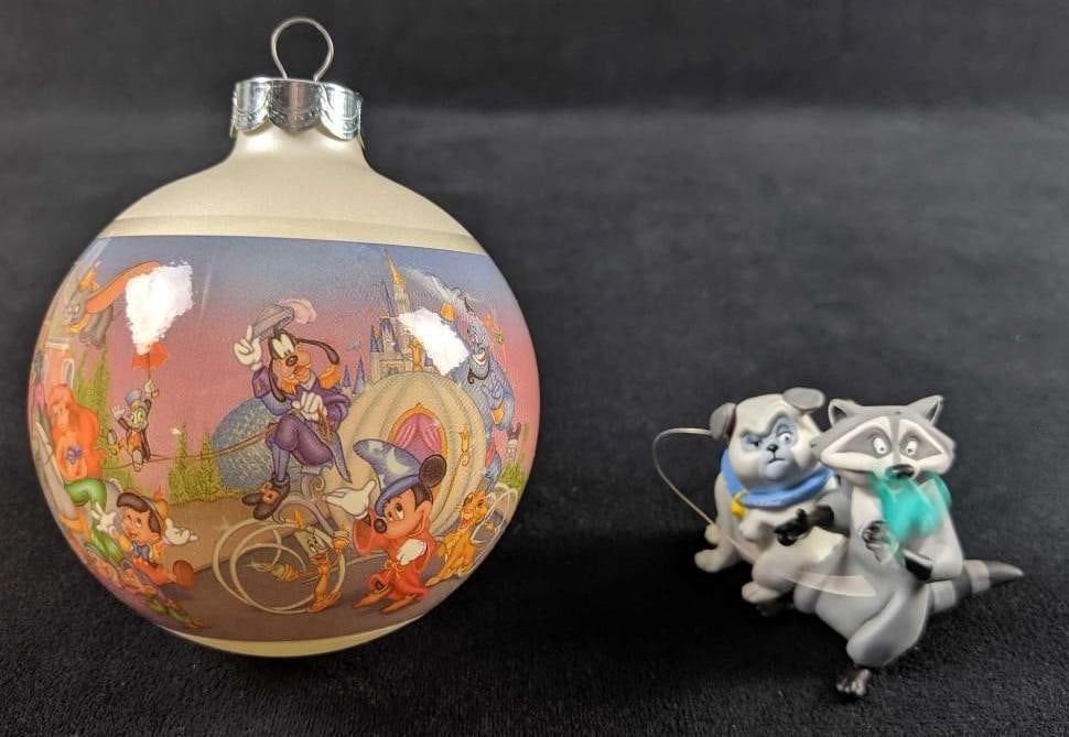 Lot Of Two Retired Disney Ornaments: This lot includes one Hallmark Keepsakes Ornament of Percy Flit and Meeko from the hit Disney animated movie, Pocahontas. This measures approx 2" x 2" x 2" and does not have its original box. And Walt