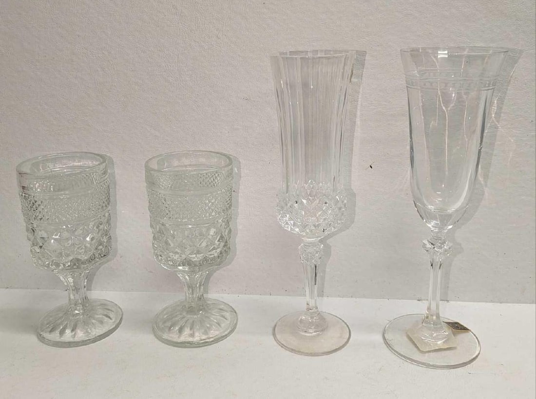 4 Vintage Cordial And Flute Glasses: 4 Vintage Cordial And Flute Glasses. This lot includes: (2) Wexford Claret Waffle Cordial Wine Glass. This is approx 2 5/8" x 2 5/8"x 5 1/2". (1) Cristal D'Arques Champagne Flute. This