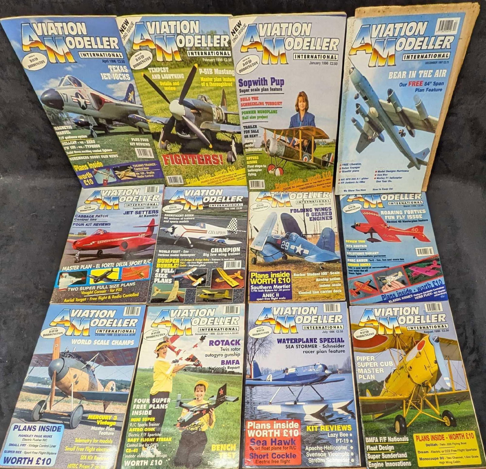 12 1990s Aviation Modeler Magazines: 12 1990s Aviation Modeler Magazines. Each of the magazines are approx 8 3/4" x 1/8" x 11 7/8" and the total weight is 7.70lbs. The covers have shelf wear. 