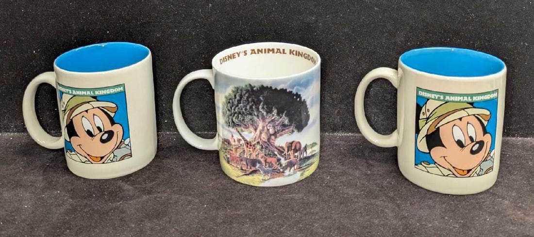 3 Disney Animal Kingdom Mickey And Tree Of Life Ceramic Mugs: 3 Disney Animal Kingdom Mickey And Tree Of Life Ceramic Mugs. This lot includes: (2) Mickey Mugs. Each is approx 4" x 5" x 3 1/4". (1) Tree Of Life Mug. This is approx 3 7/8" x 5 1/2&#