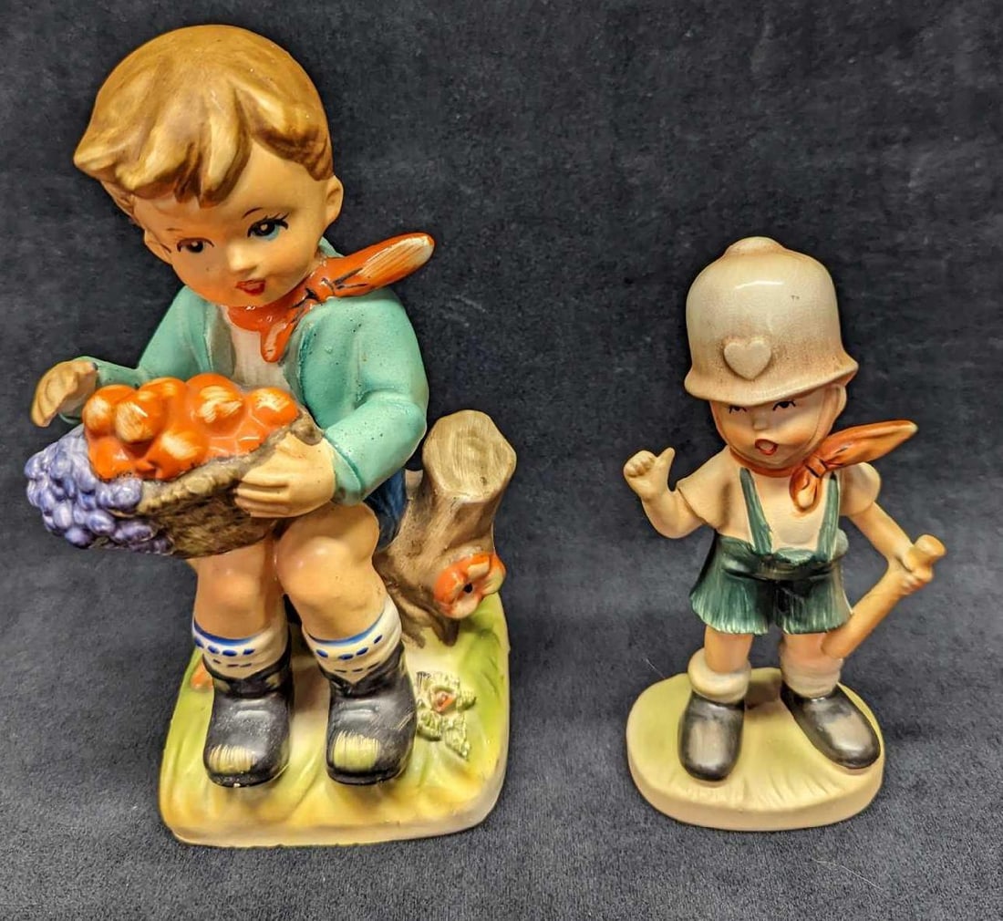 2 Vintage Made In Japan Boy Figurines: 2 Vintage Made In Japan Boy Figurines. This lot includes: (1) Enesco Porcelain Boy With Apples Figurine. This is approx 3 1/2" x 3 1/4" x 8" and it weighs 0.82lb. The figurine has some cra
