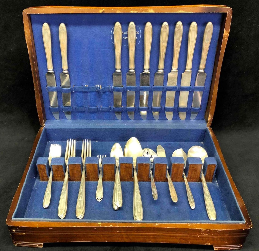 Inlaid Silver Plated Silverware Set Holmes & Edwards Silverware: This lot contains an inlaid silver plated silverware set by Holmes & Edwards. This set includes silver plated forks, knives and spoons. This is not a full set. There are 15 spoons, (3 soup, 6 dinner, 