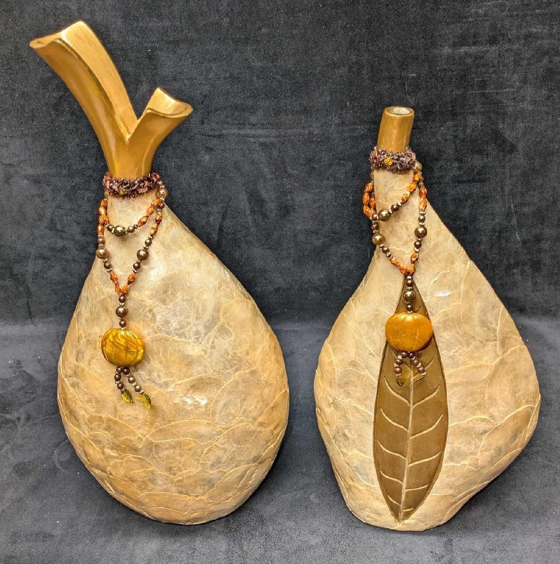 2 Resin Shell Layered Mantel Vases D: 2 Resin Shell Layered Mantel Vases D. This appears two resin or plaster vases covered with a shell material. Suitable for faux flowers. The taller vase is approx 8 1/2" x 5" x 18 1/2" and it weighs